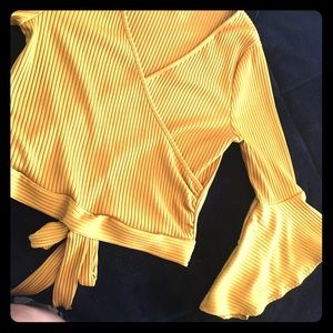 A stunning mustard yellow crop top.